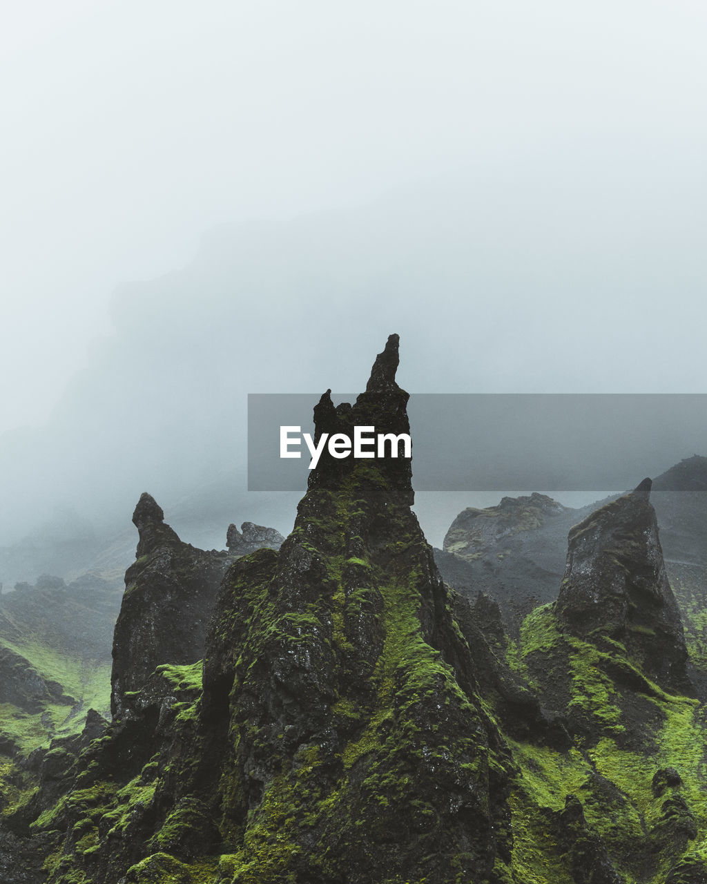 Rock formations on mountain against sky