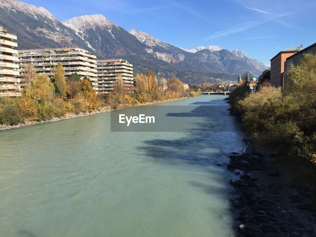 River amidst buildings against sky