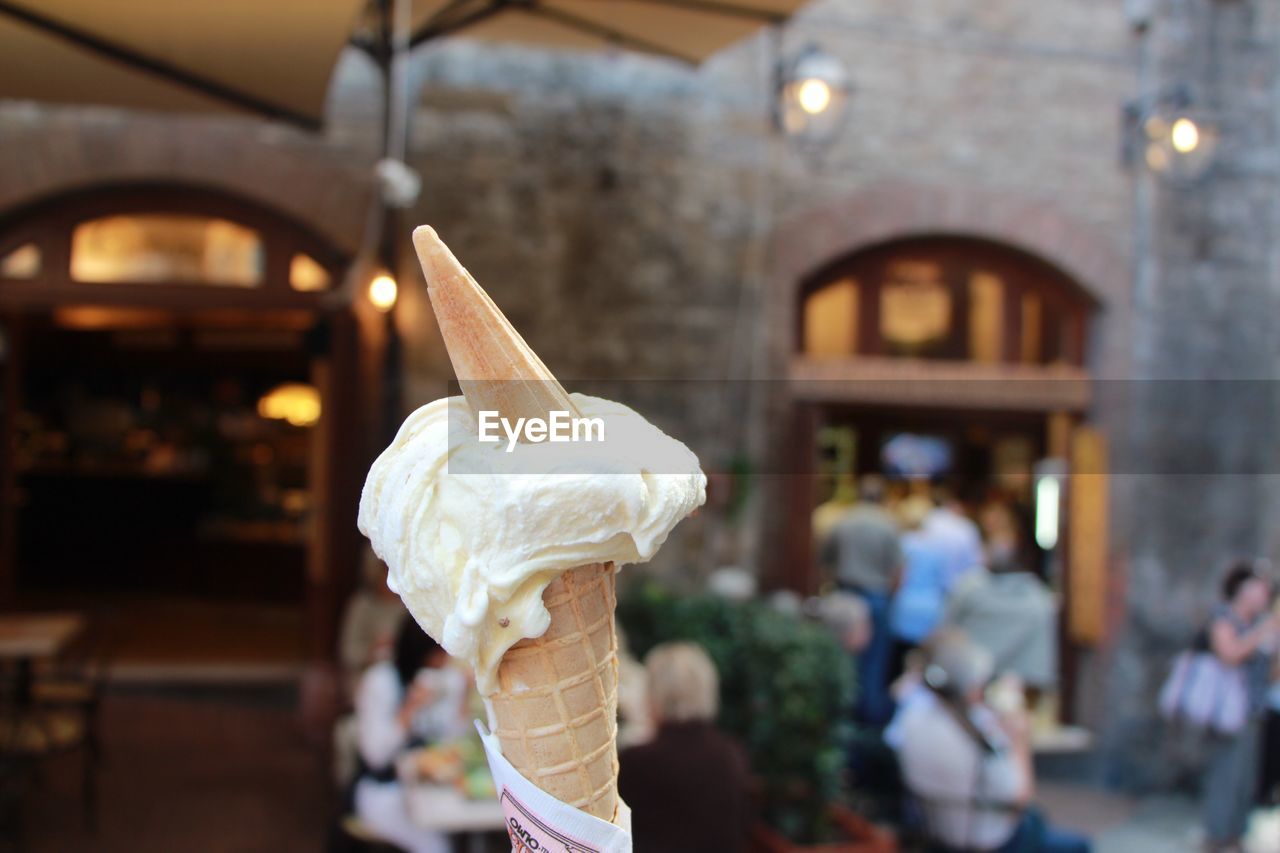 Close-up of ice cream cone at street