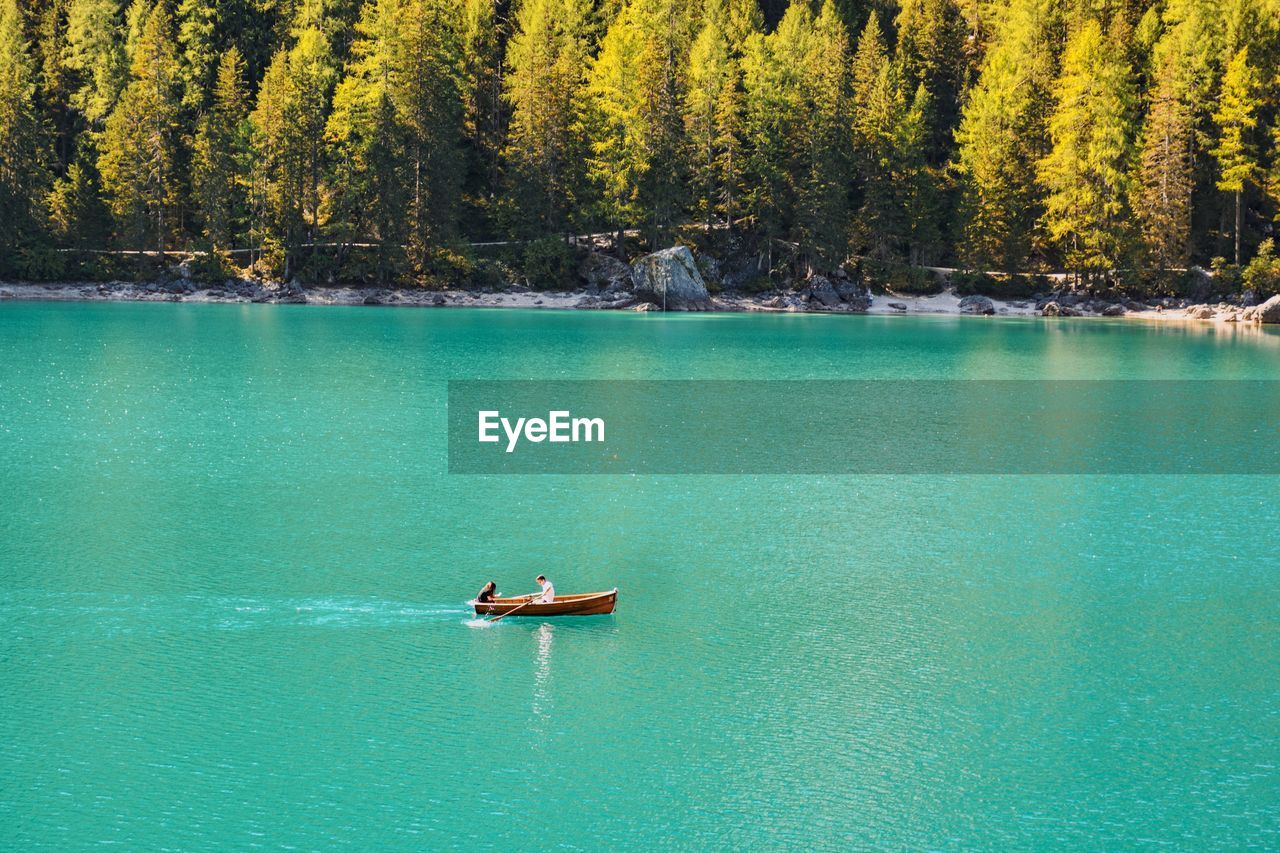 Scenic view of lake against trees. boat on a lake.