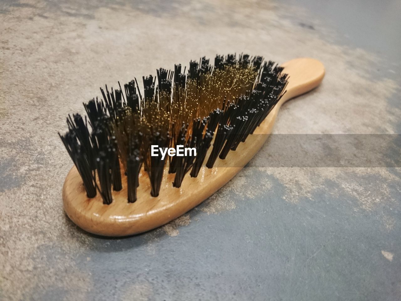 High angle view of clothes brush on floor