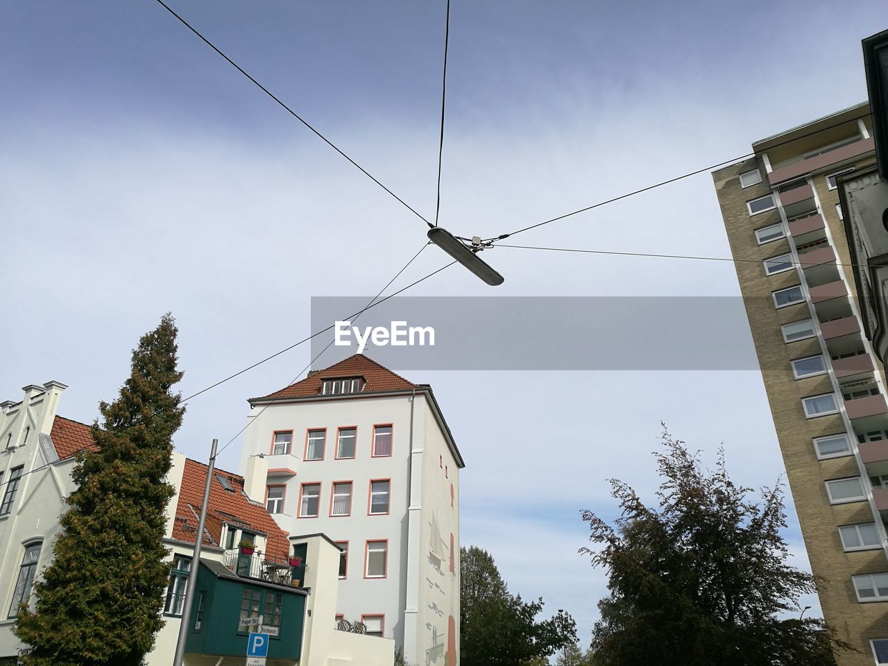 LOW ANGLE VIEW OF RESIDENTIAL BUILDINGS AGAINST SKY