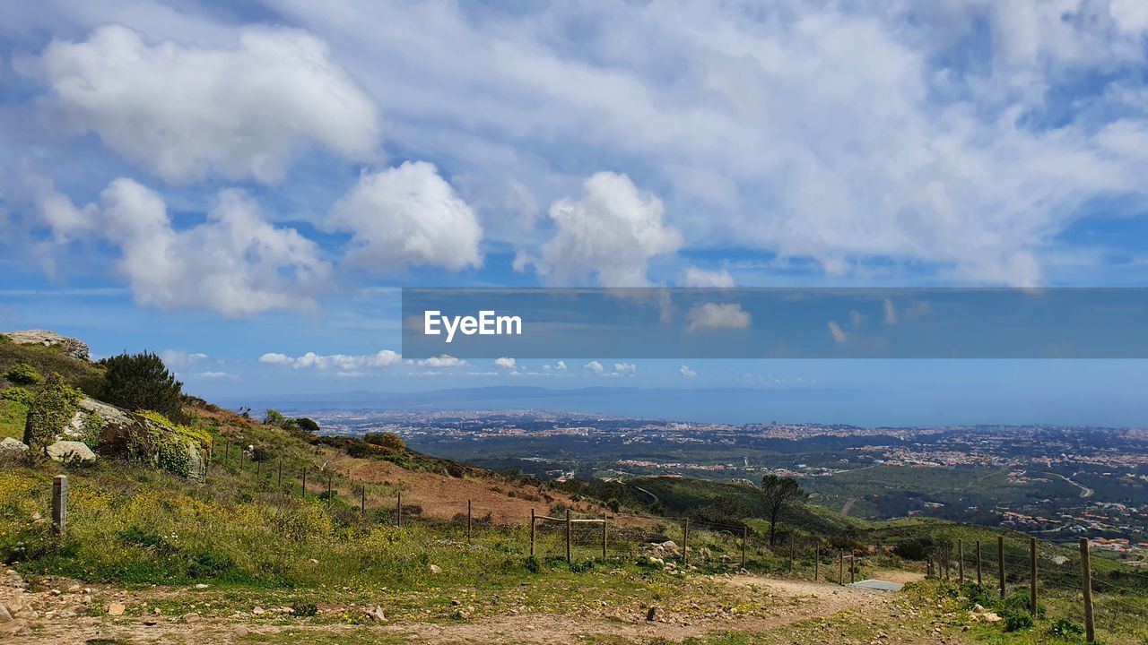 sky, environment, landscape, cloud, scenics - nature, nature, mountain, horizon, land, beauty in nature, travel destinations, travel, tourism, plant, no people, rural area, sea, tranquility, outdoors, panoramic, architecture, water, city, blue, tree, tranquil scene, day, building, plateau, trip, social issues, vacation, cloudscape, grass, coast, rural scene, mountain range, holiday, built structure