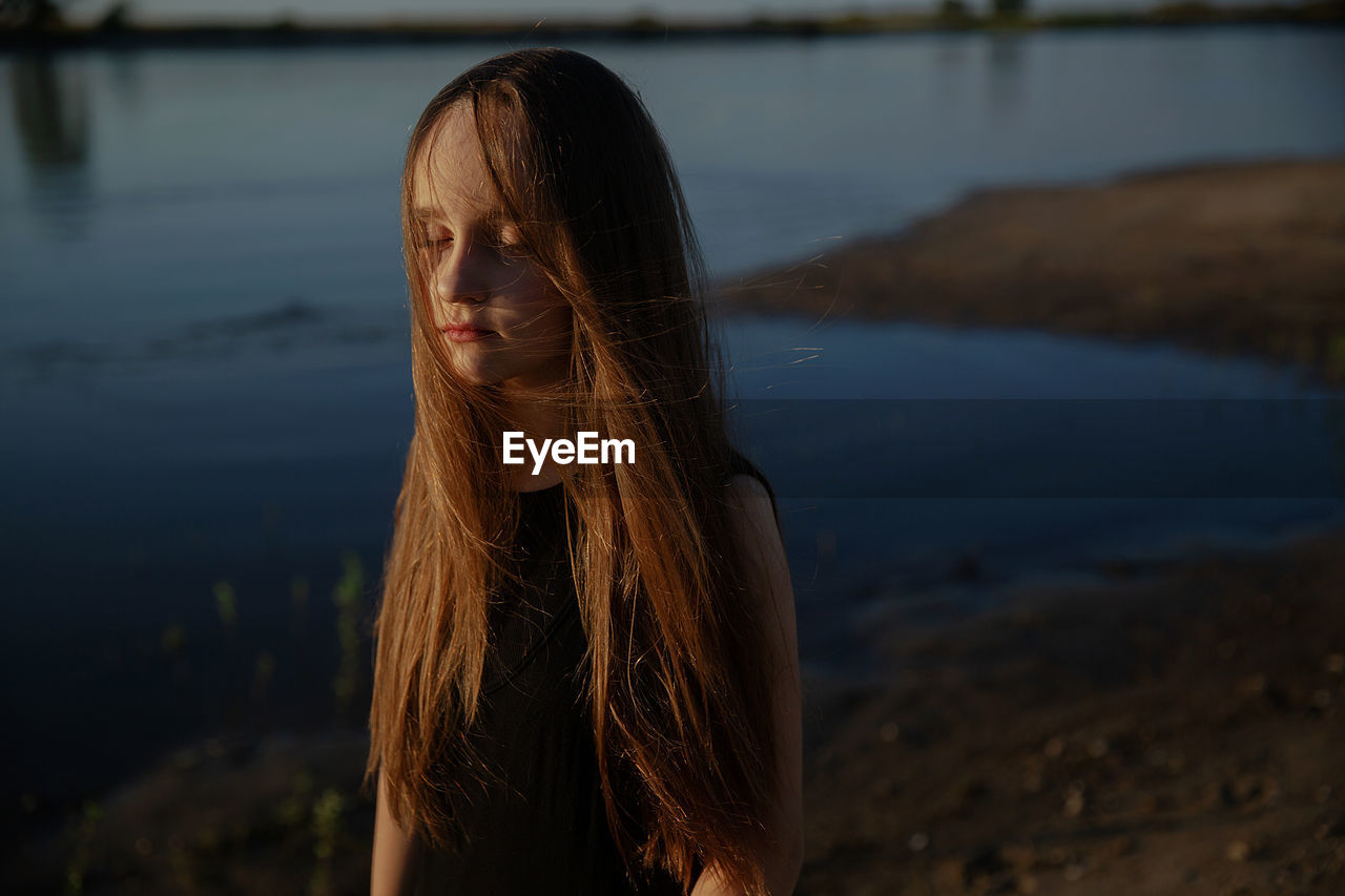 Portrait of teenage girl in water