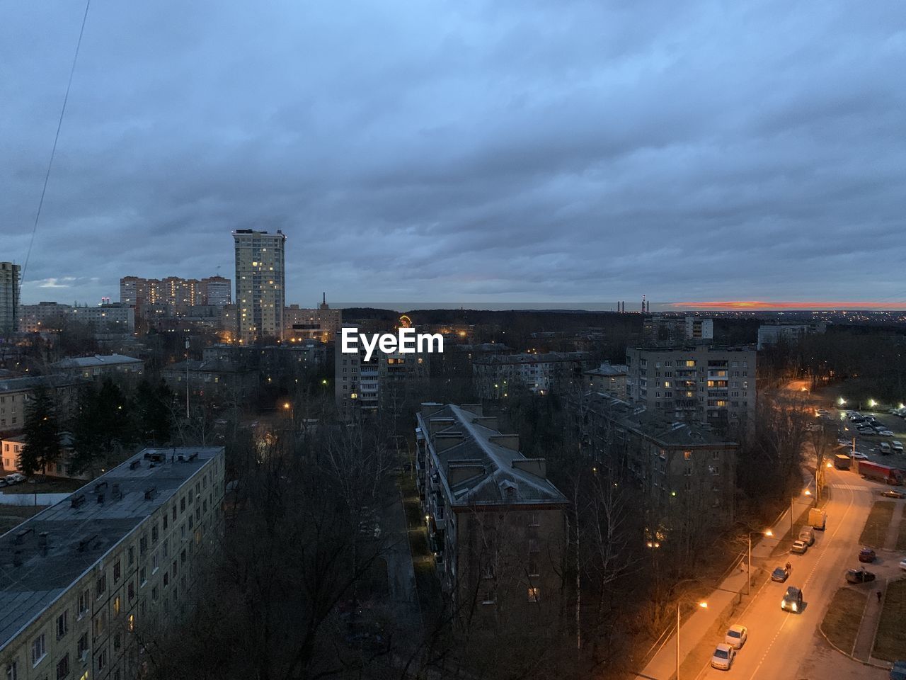 HIGH ANGLE VIEW OF ILLUMINATED BUILDINGS AGAINST SKY