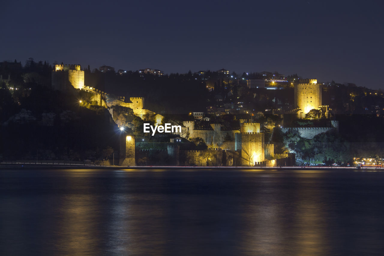 Illuminated buildings in city at night