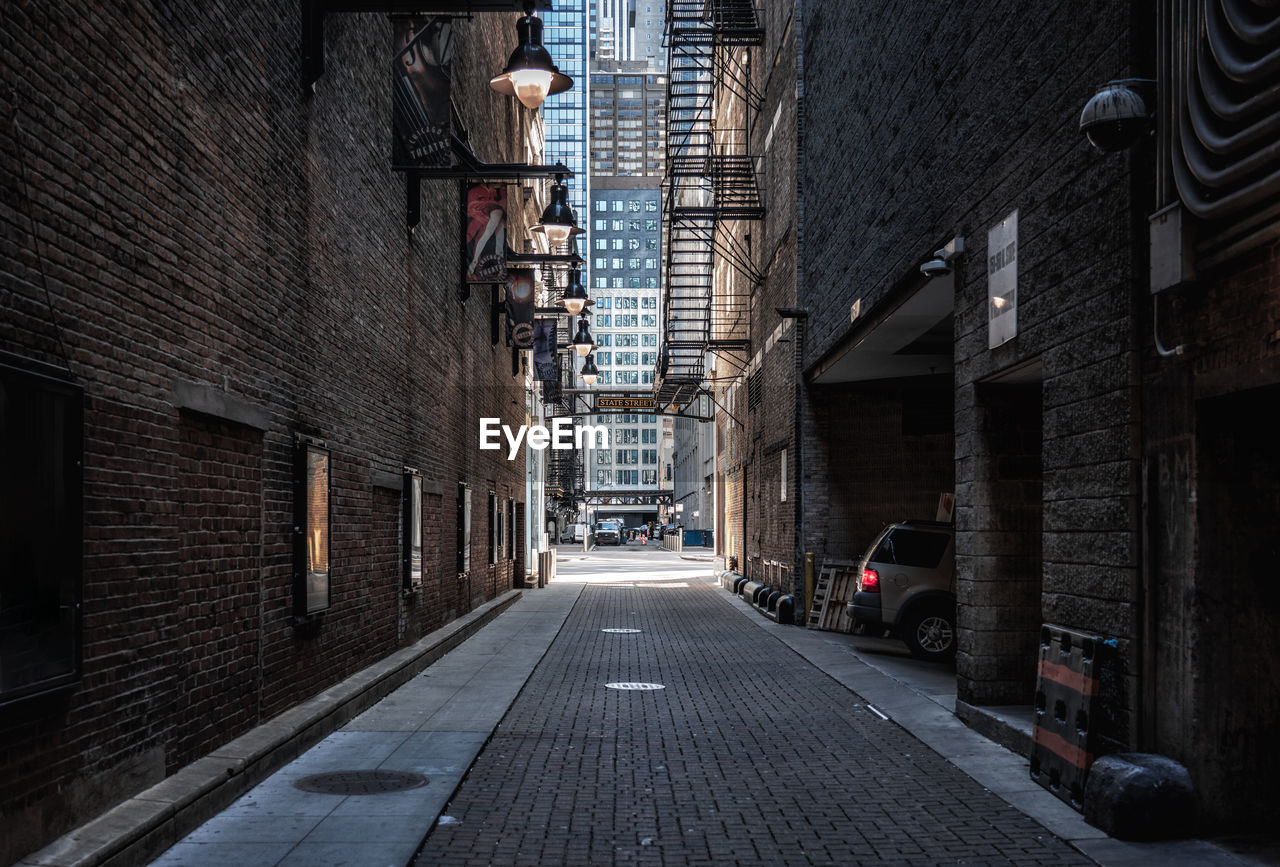 NARROW STREET BETWEEN BUILDINGS IN CITY