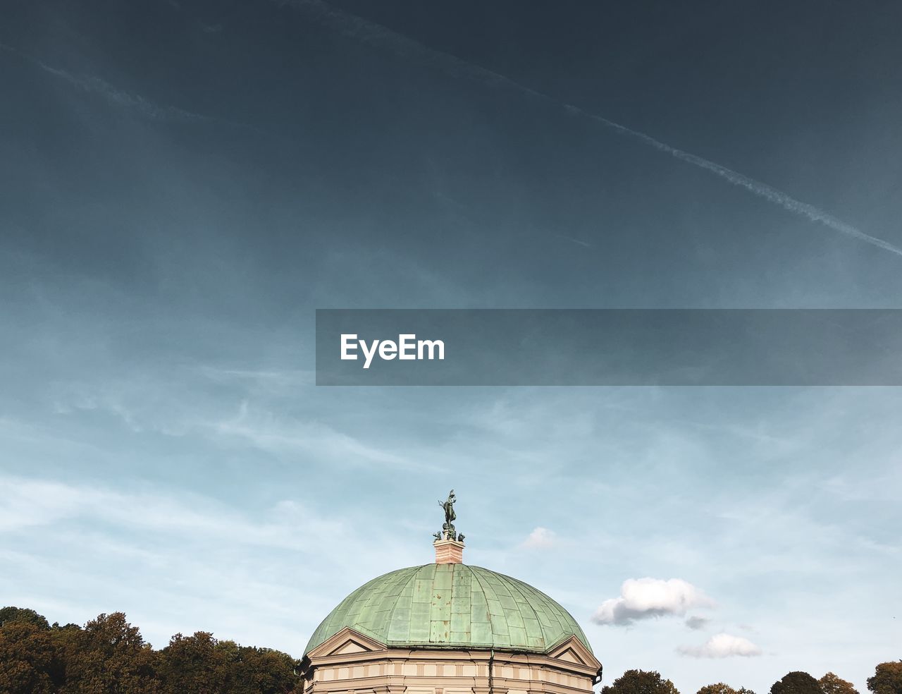 Low angle view of a building against cloudy sky