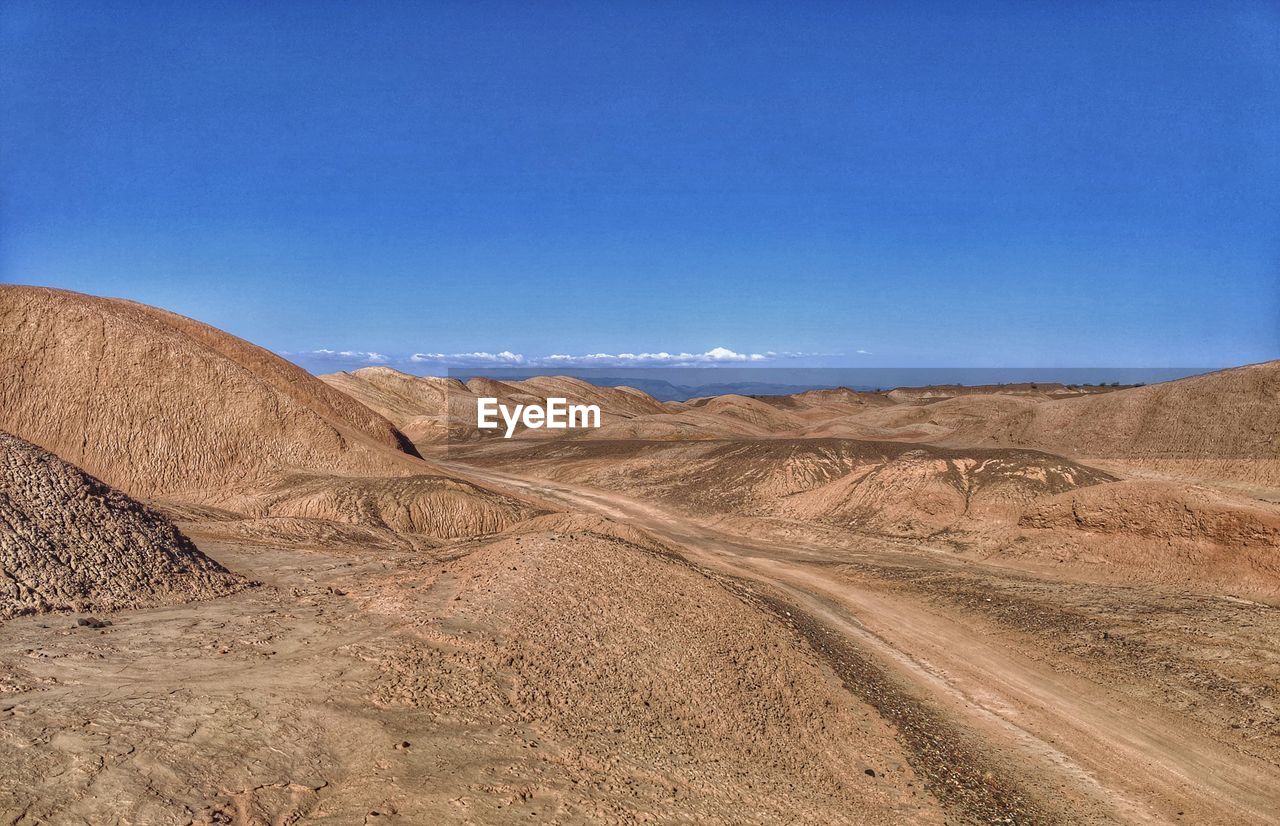 Scenic view of desert against sky