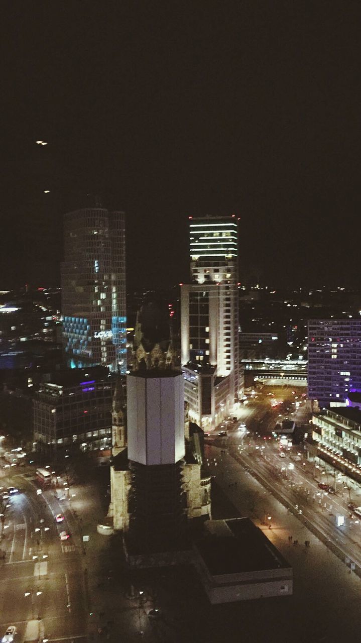 HIGH ANGLE VIEW OF CITY AT NIGHT