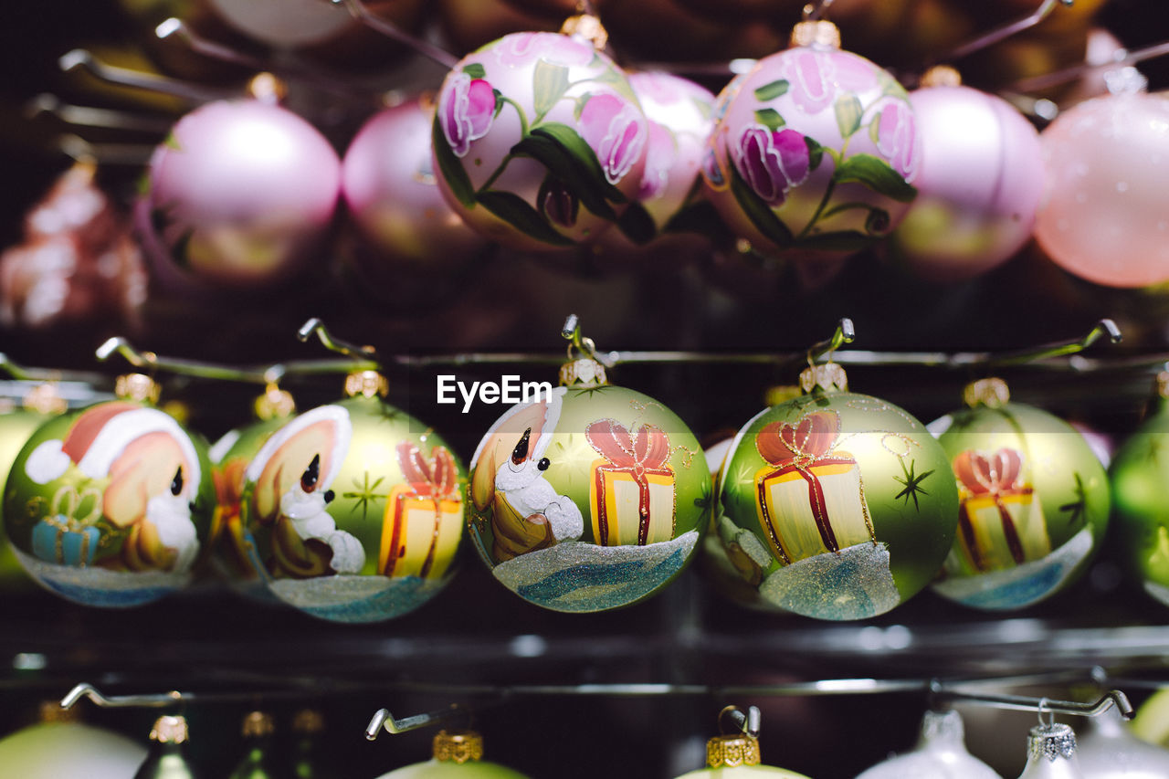 Close-up of christmas decorations hanging indoors