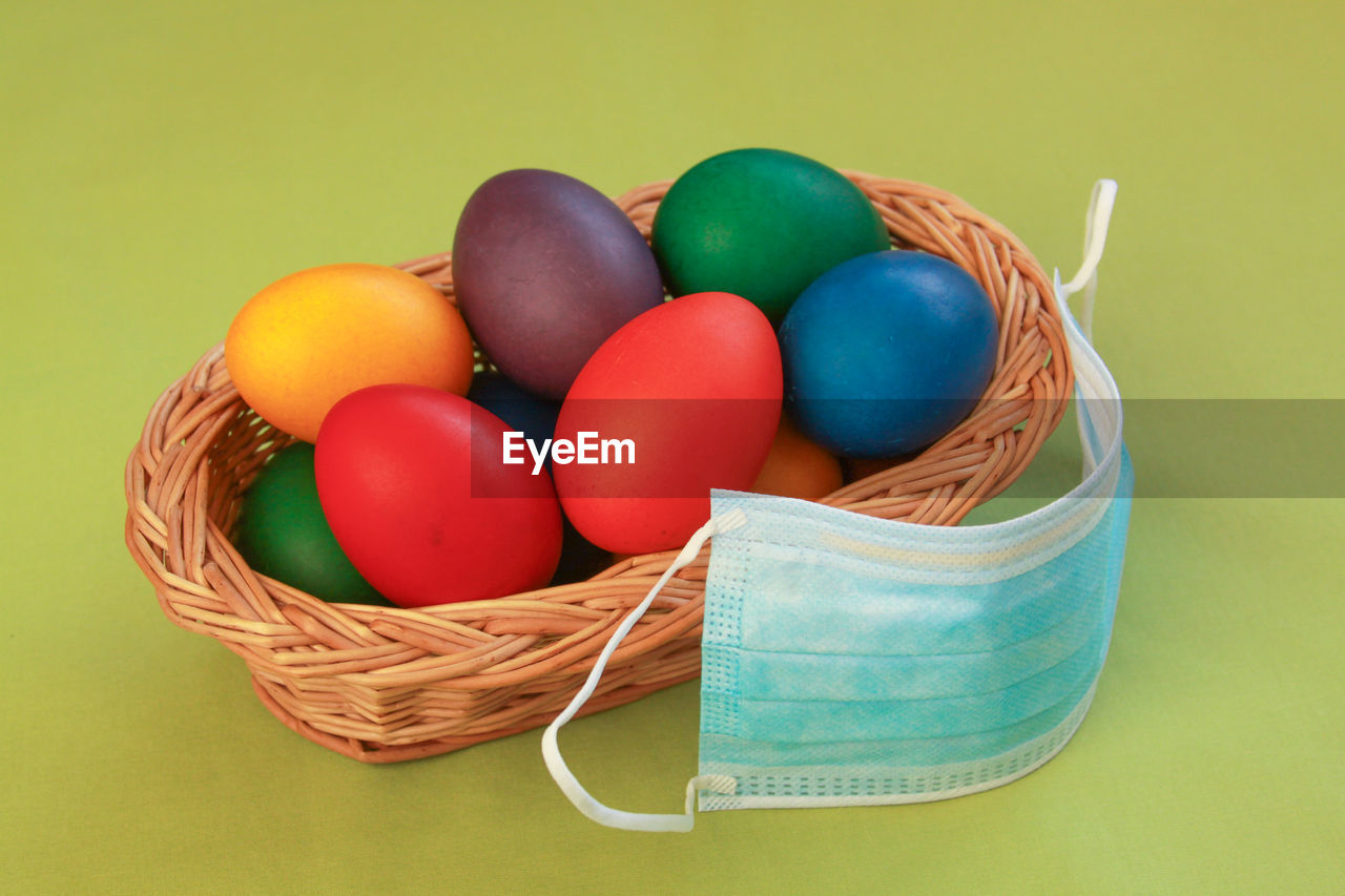 HIGH ANGLE VIEW OF EGGS IN BASKET ON TABLE