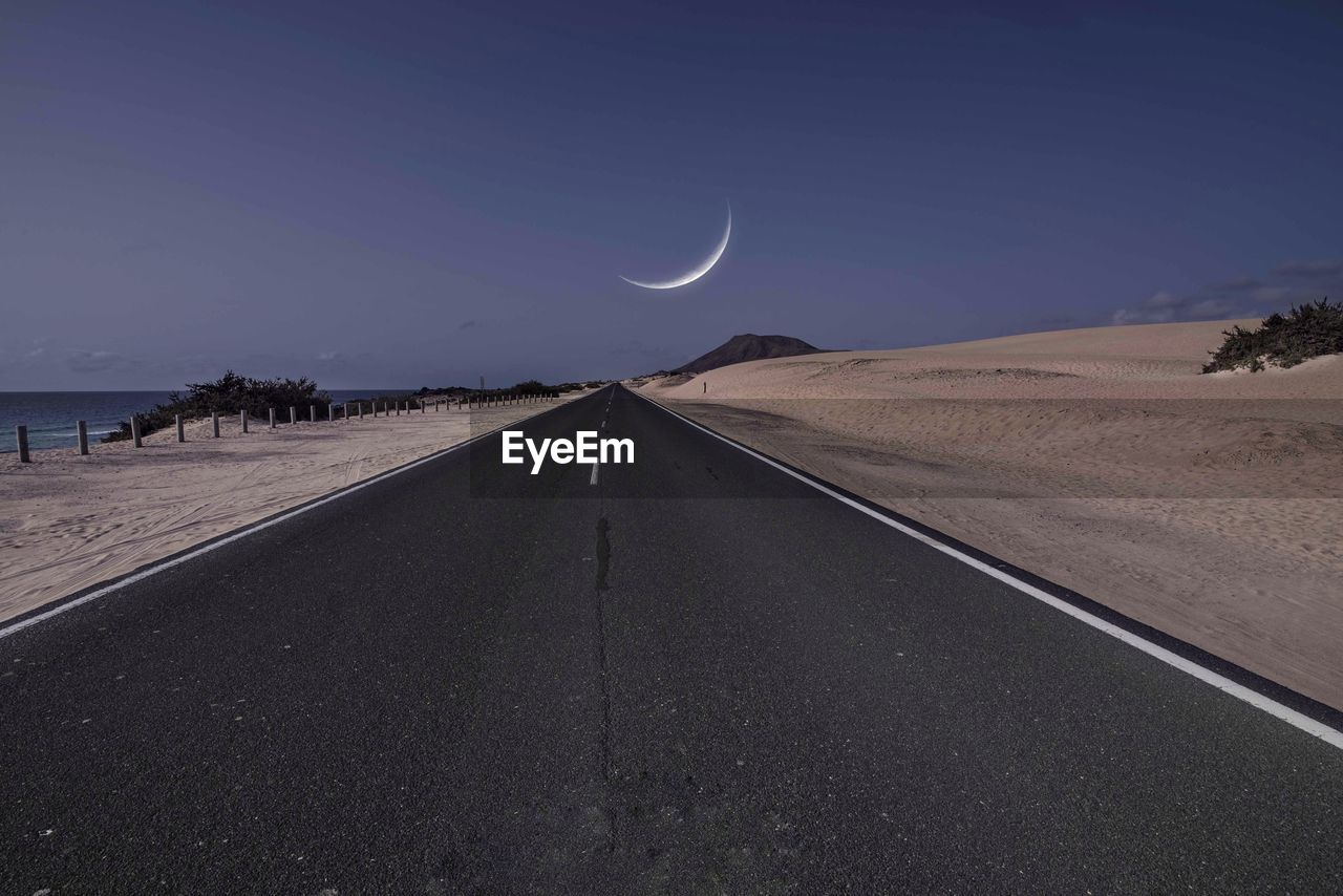 Scenic view of road against clear sky