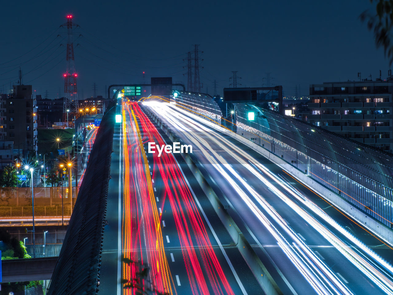 High angle view of light trails on road at night