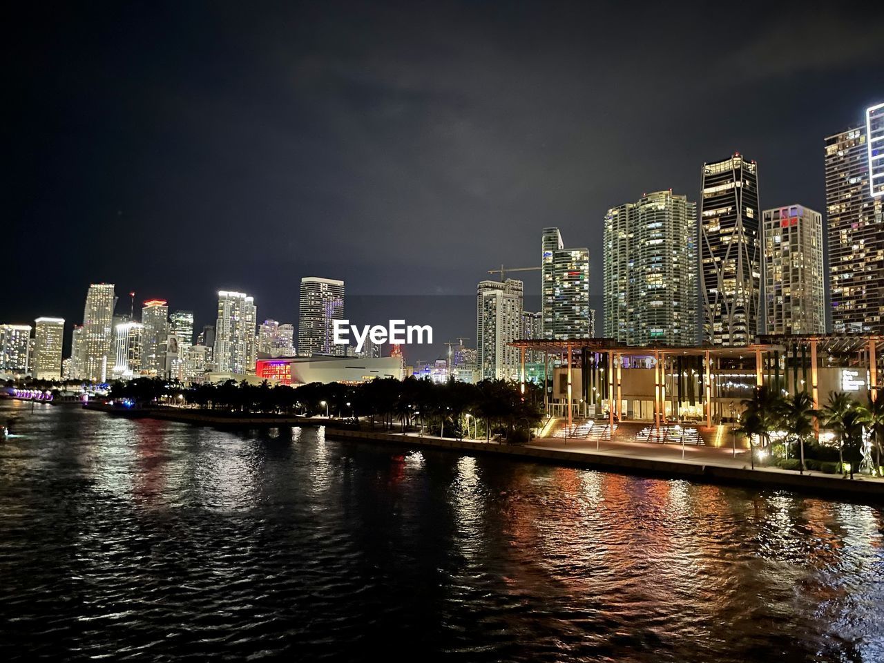 architecture, city, building exterior, built structure, skyline, office building exterior, building, skyscraper, cityscape, reflection, night, landscape, illuminated, sky, water, urban skyline, metropolitan area, urban area, metropolis, residential district, downtown, dusk, travel destinations, downtown district, horizon, city life, nature, waterfront, office, evening, no people, landmark, tower block, river, outdoors, travel, business, transportation, development
