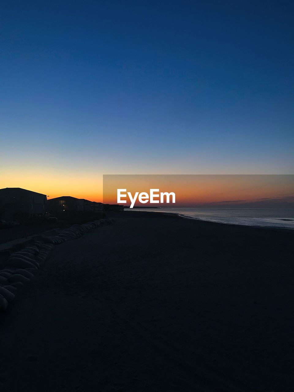 SCENIC VIEW OF BEACH DURING SUNSET