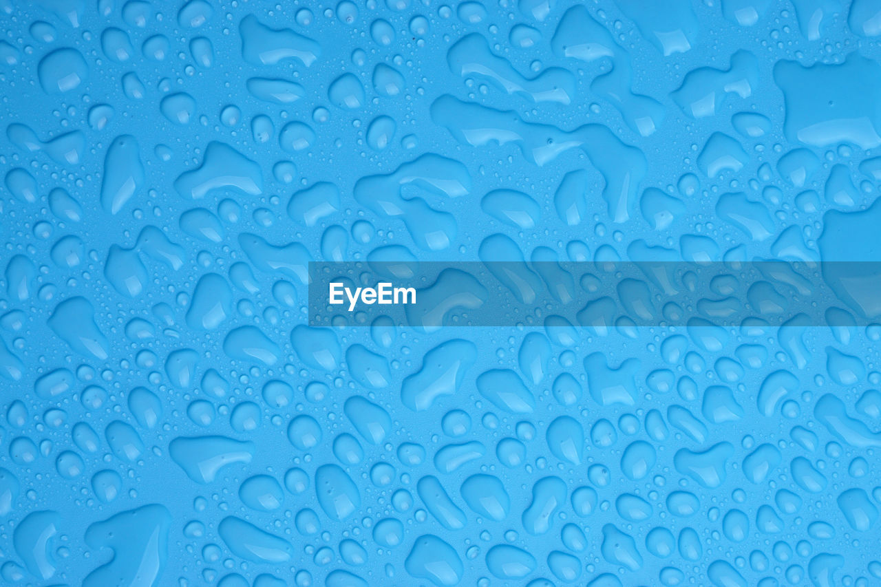 Water drops on blue background