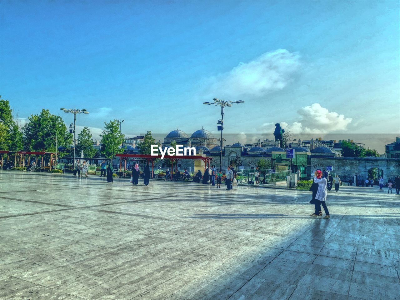 PEOPLE WALKING IN TOWN SQUARE