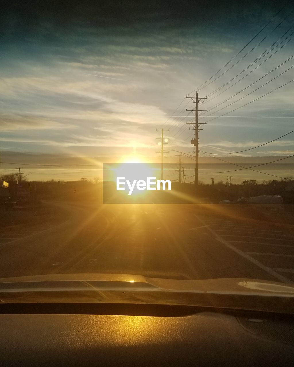 ROAD AGAINST SKY AT SUNSET