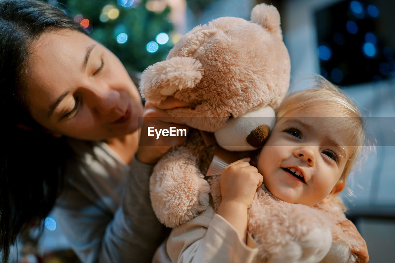 close-up of cute girl with teddy bear