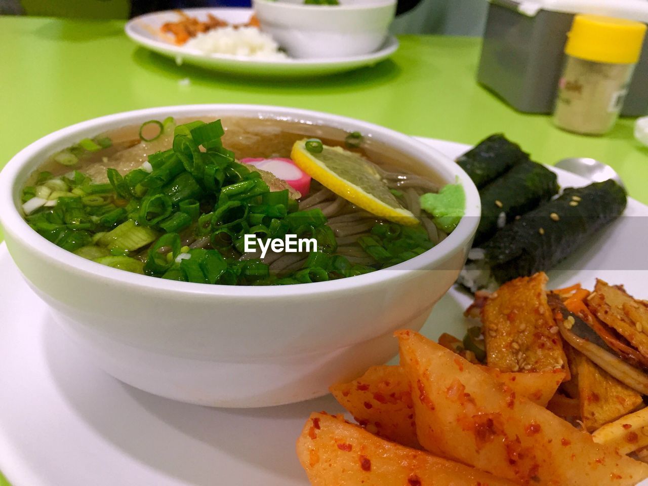 Close-up of food served in bowl and plate on table