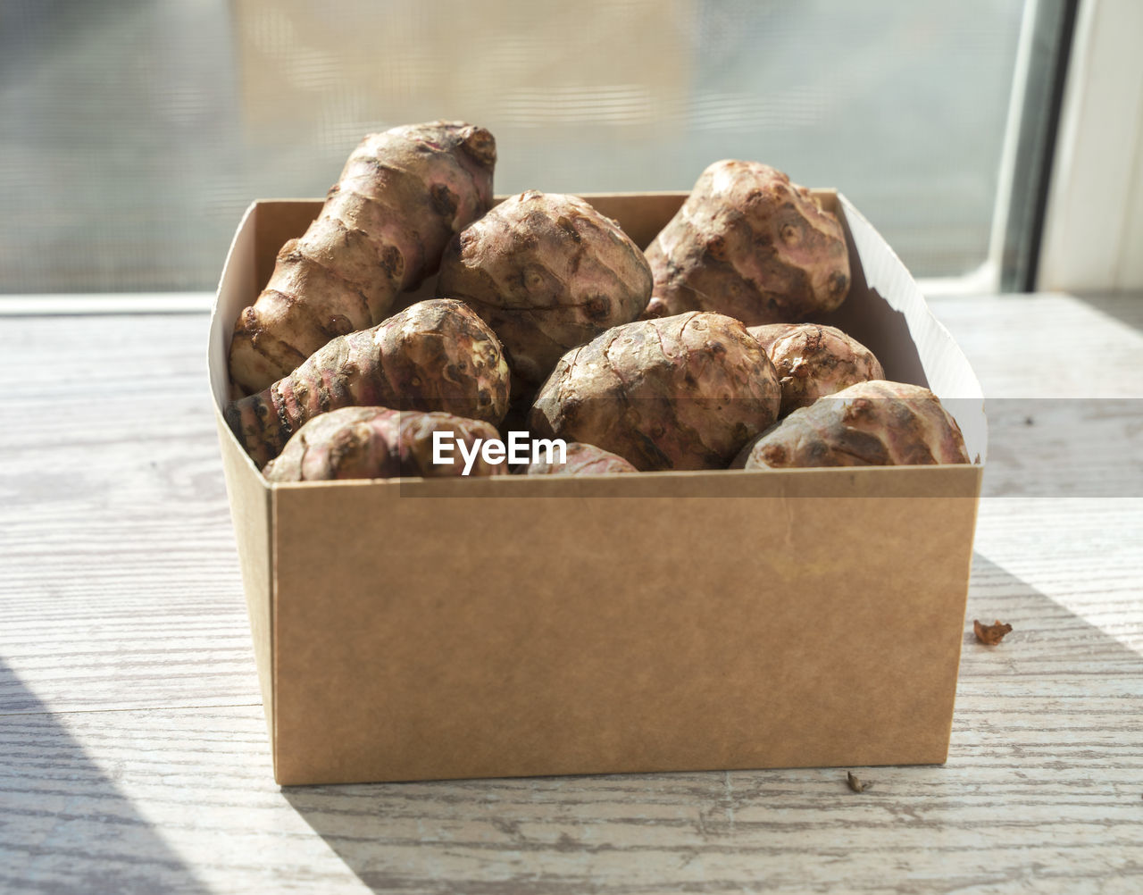 food and drink, food, freshness, produce, chocolate, healthy eating, container, wellbeing, no people, edible mushroom, still life, table, indoors, baked, wood, dessert, vegetable, paper, day, walnut, focus on foreground, box, close-up, sunlight