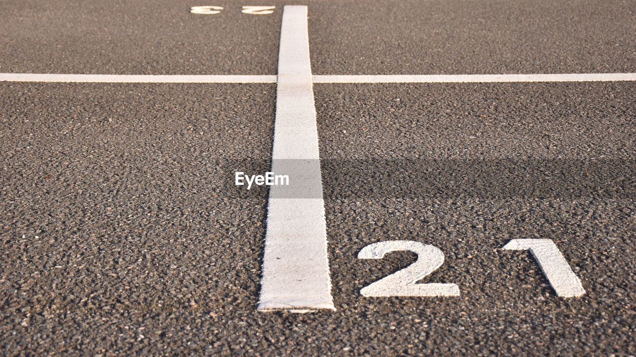 High angle view of sign on road