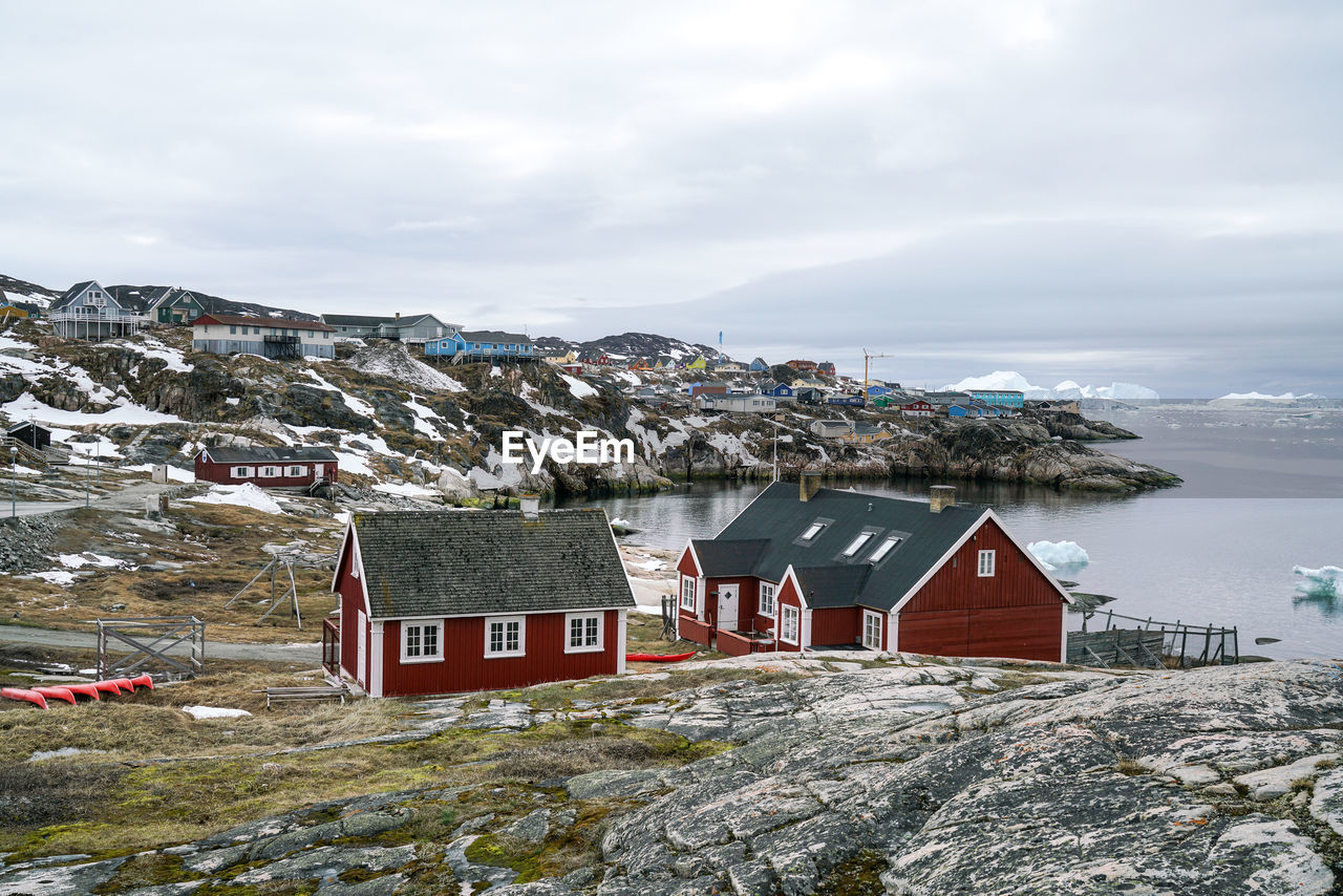 HOUSES AGAINST SKY