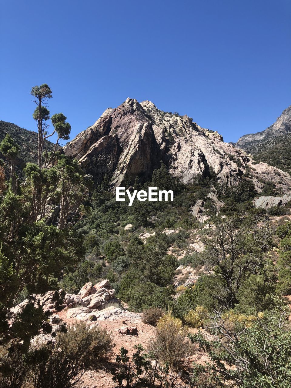 Scenic view of rocky mountains against clear sky