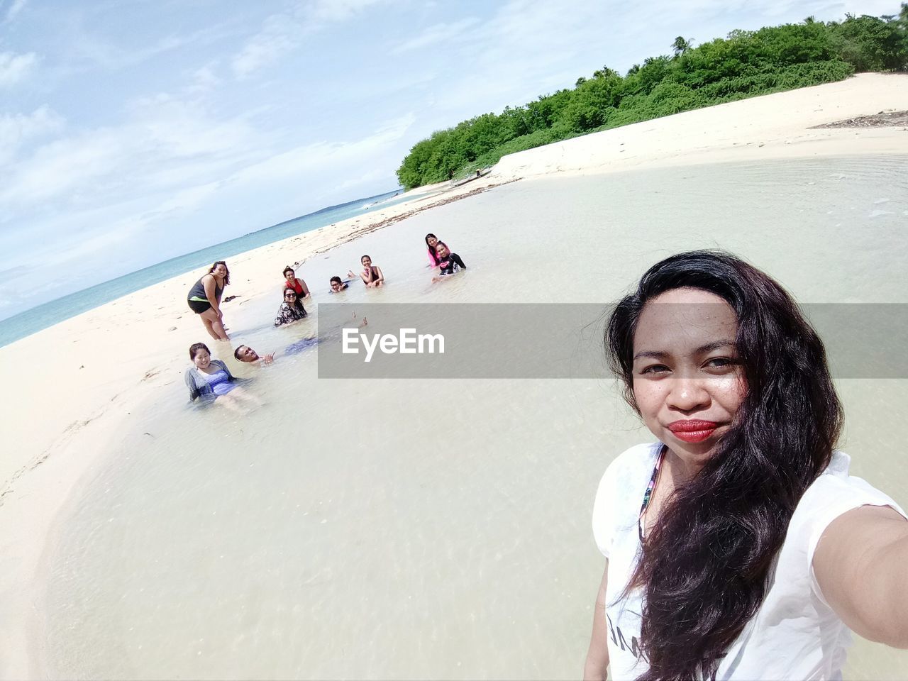 WOMEN STANDING ON BEACH