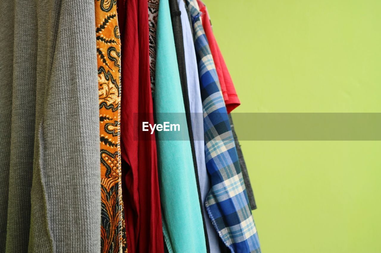 Close-up of multi colored clothes hanging on display at store