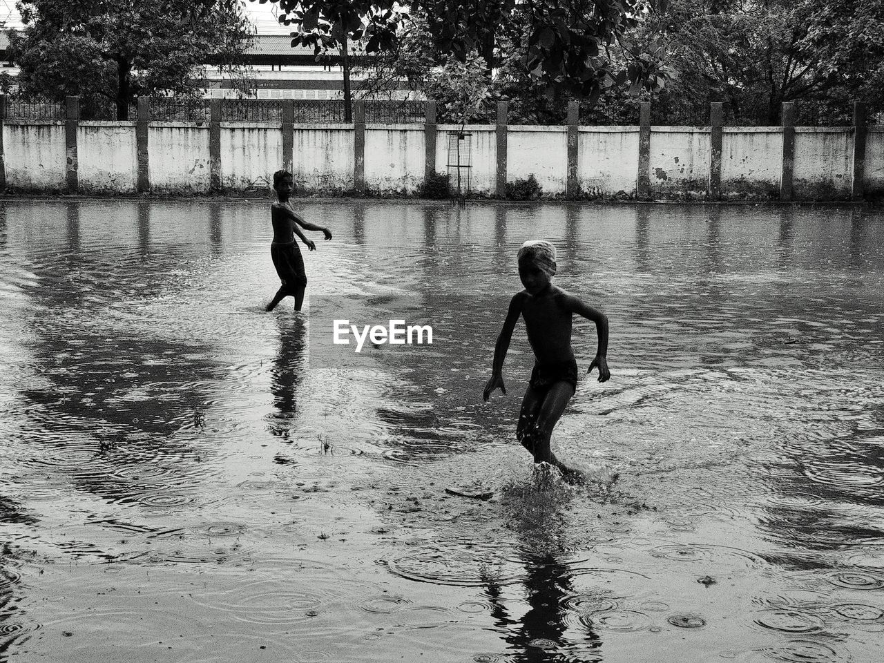 MEN PLAYING IN WATER