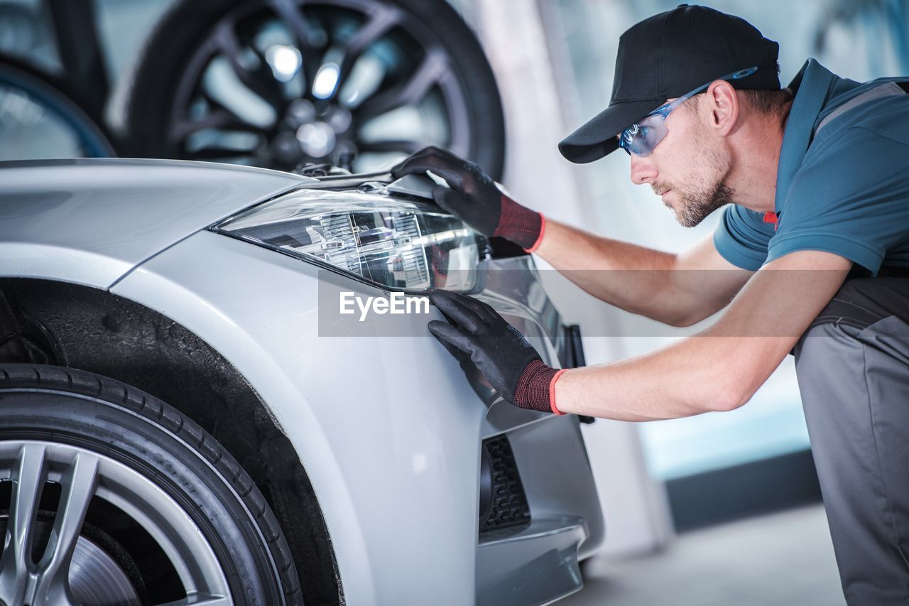 Mechanic repairing car in auto repair shop