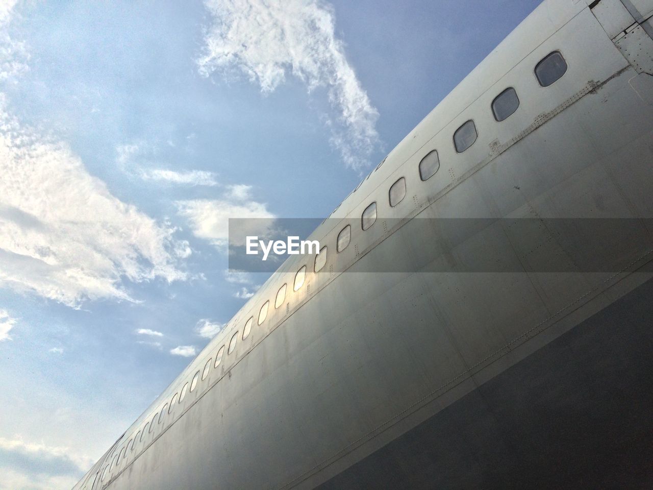 LOW ANGLE VIEW OF WHITE BUILDING AGAINST SKY