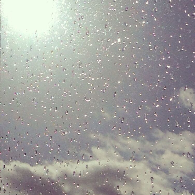 CLOSE-UP OF WATER DROPS ON WINDOW