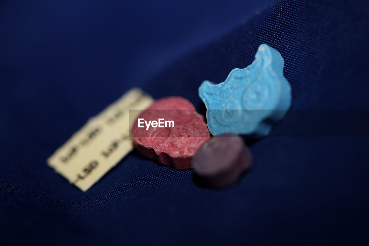 close-up of dices on blue table