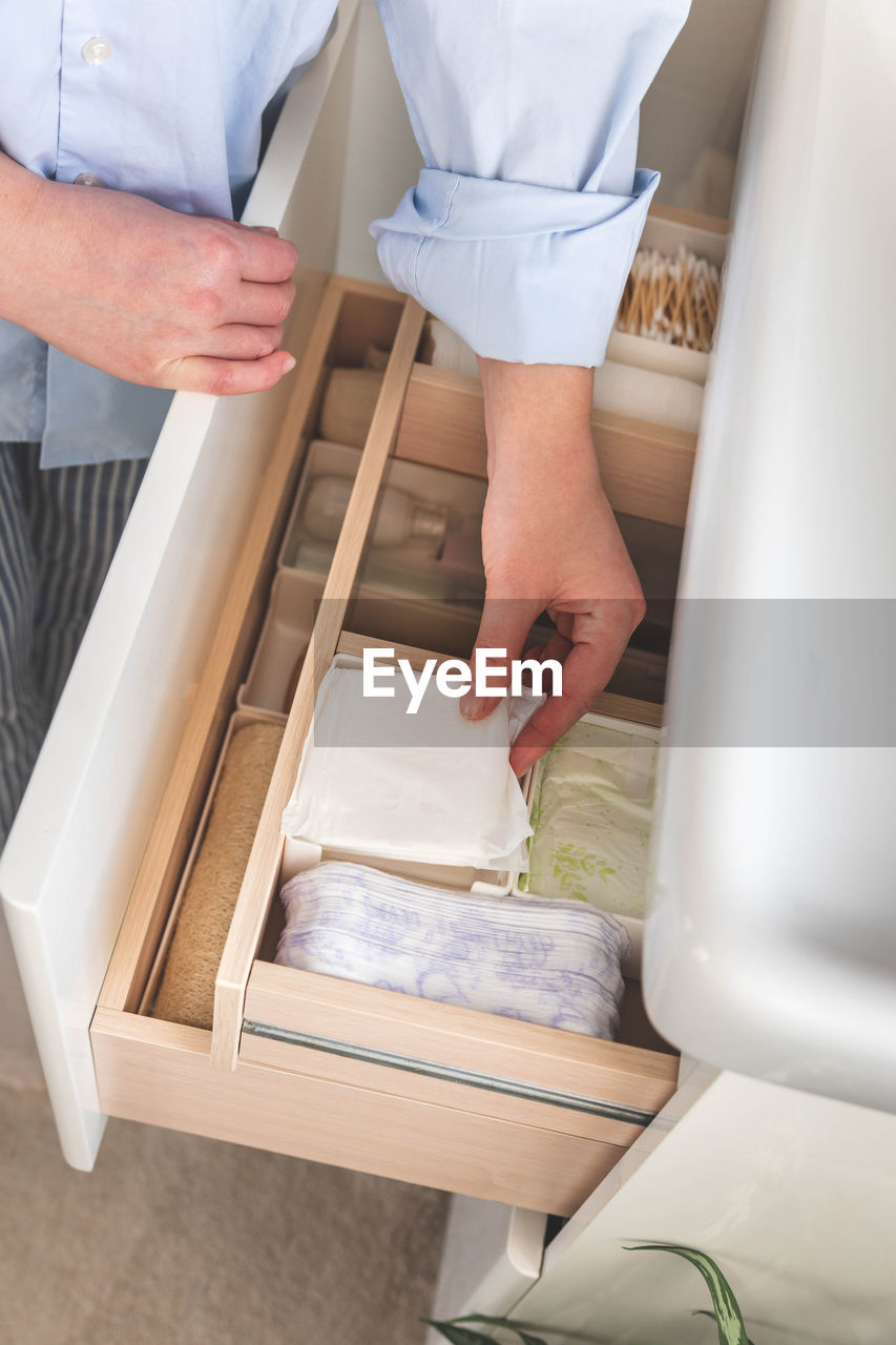 high angle view of woman standing in kitchen