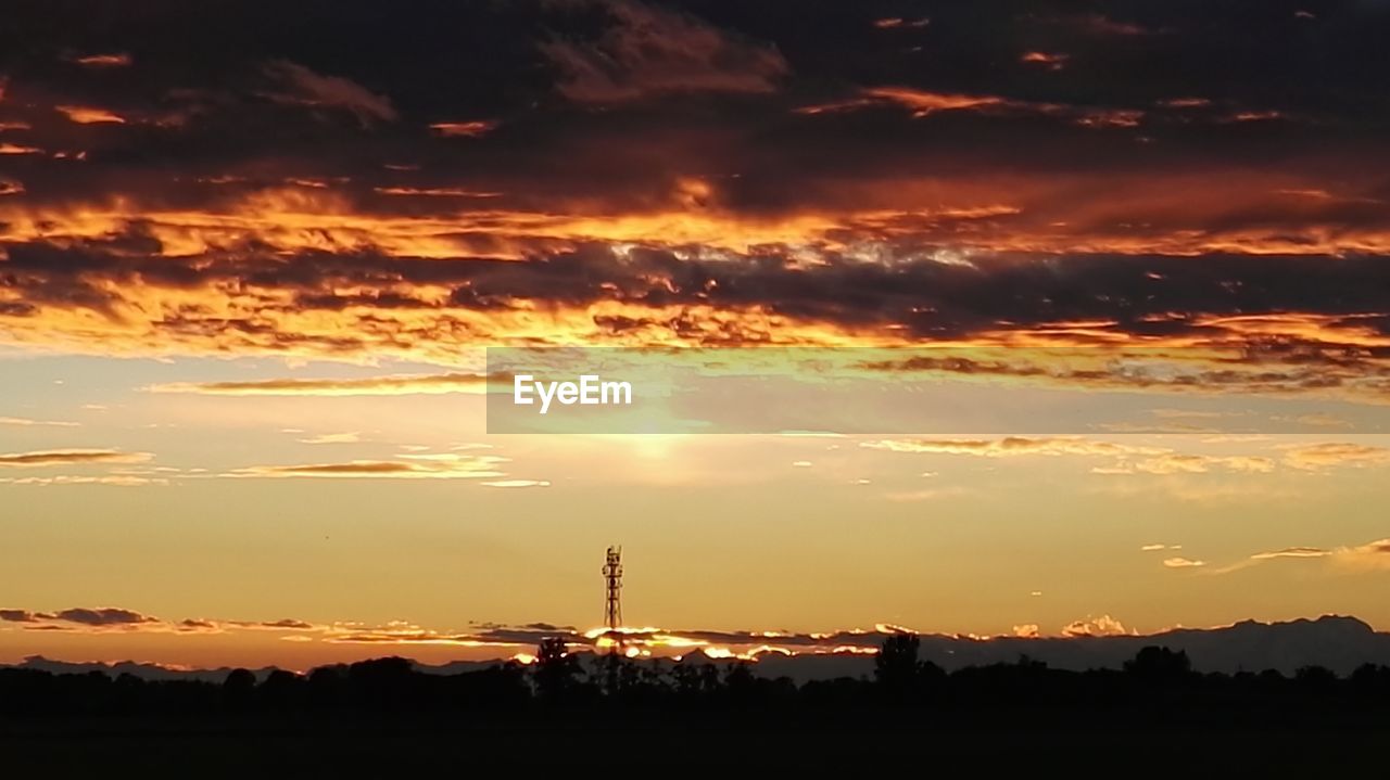 SILHOUETTE OF LANDSCAPE AT SUNSET