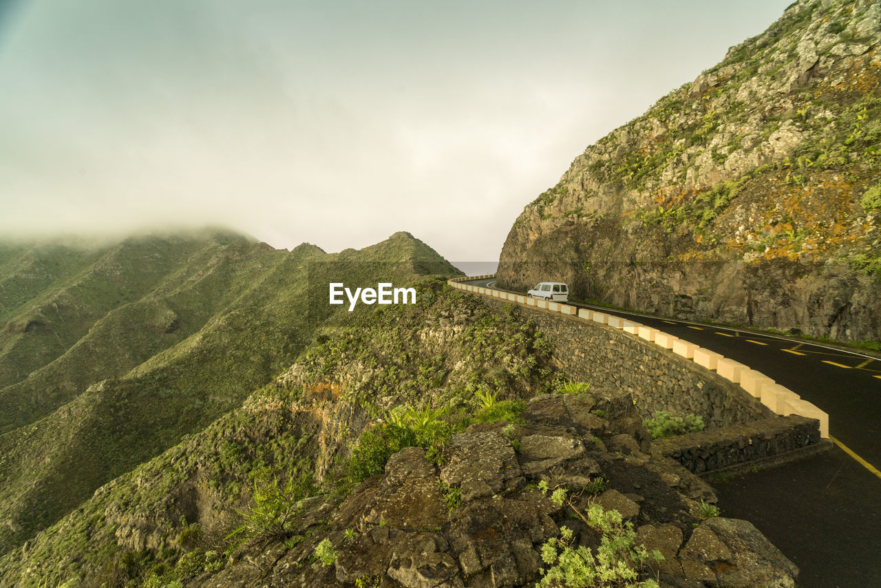 Car on mountain road at el teide near masca in winter