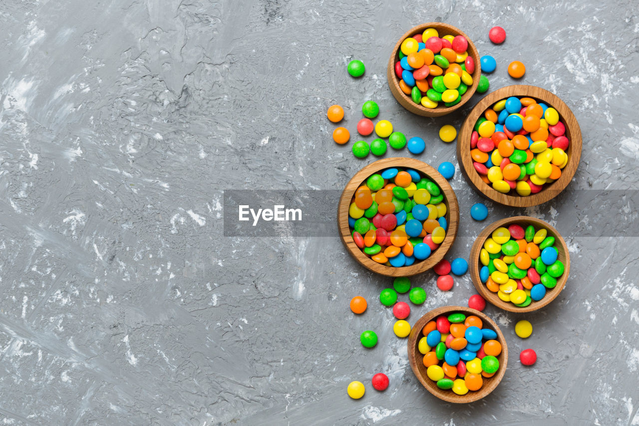 multi colored, sweet food, sweet, food and drink, food, variation, dessert, candy, no people, high angle view, large group of objects, still life, indoors, confectionery, directly above, freshness, sprinkles, studio shot, gray, unhealthy eating, gray background, baked, snack, chocolate, copy space, abundance, temptation