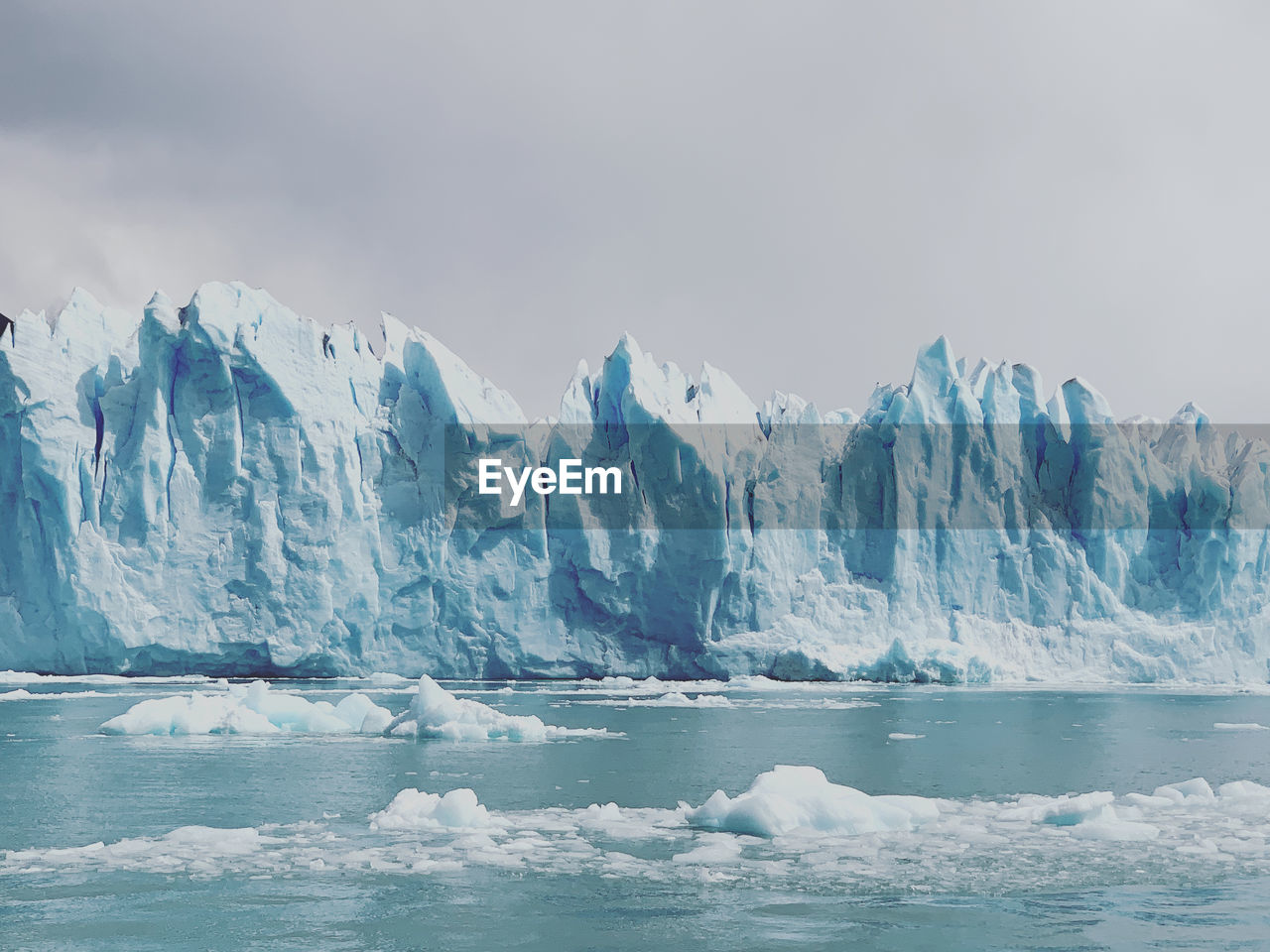 Scenic view of frozen glacier against sky in perito moreno 