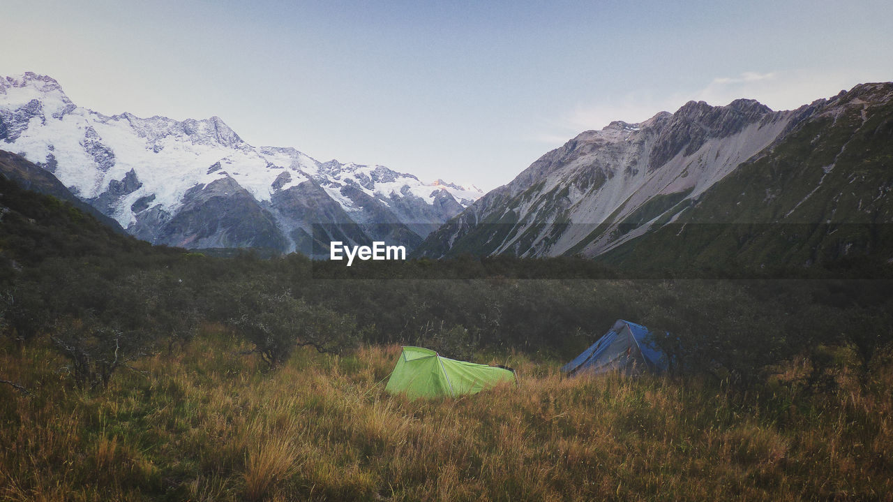 Tents on mountain against sky