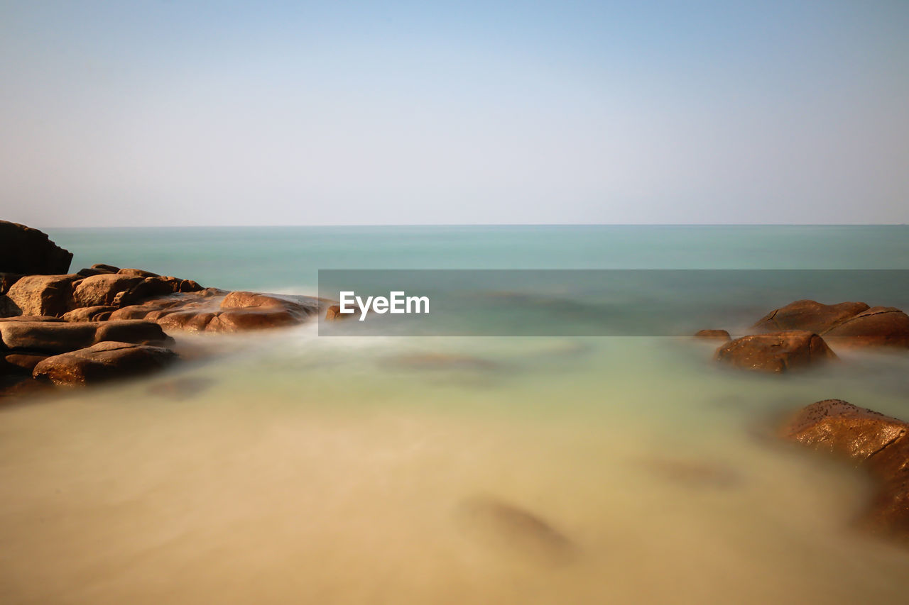 Scenic view of sea against clear sky