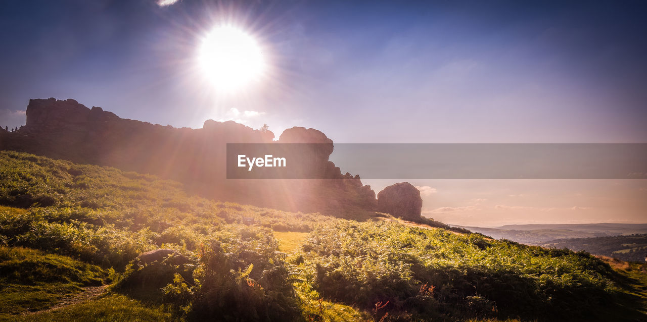 Scenic view of landscape against sky during sunset