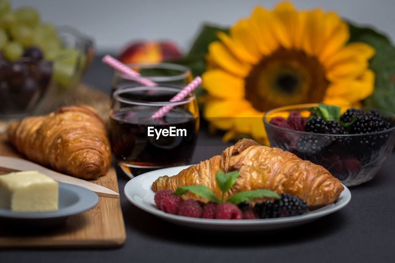 Close-up of croissants with berries on table