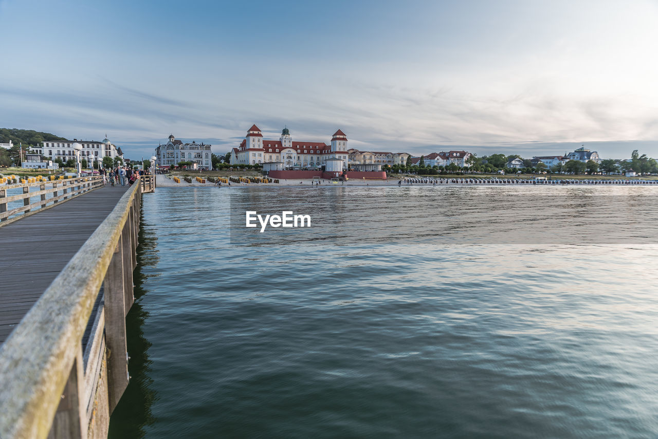 PIER BY SEA AGAINST BUILDINGS IN CITY