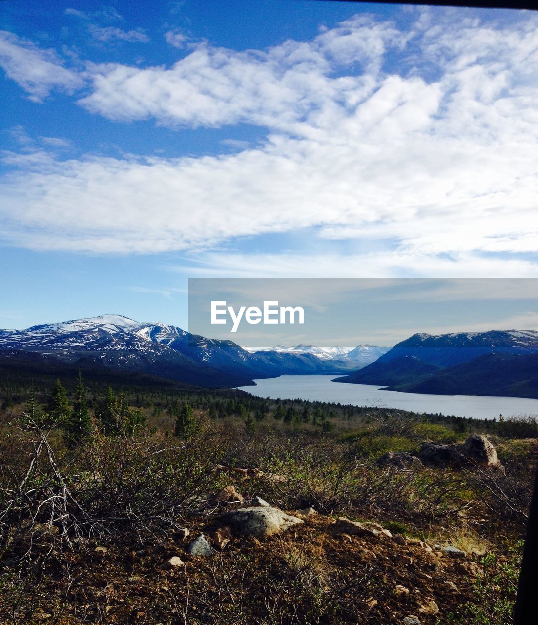 SCENIC VIEW OF LANDSCAPE AND MOUNTAINS AGAINST SKY