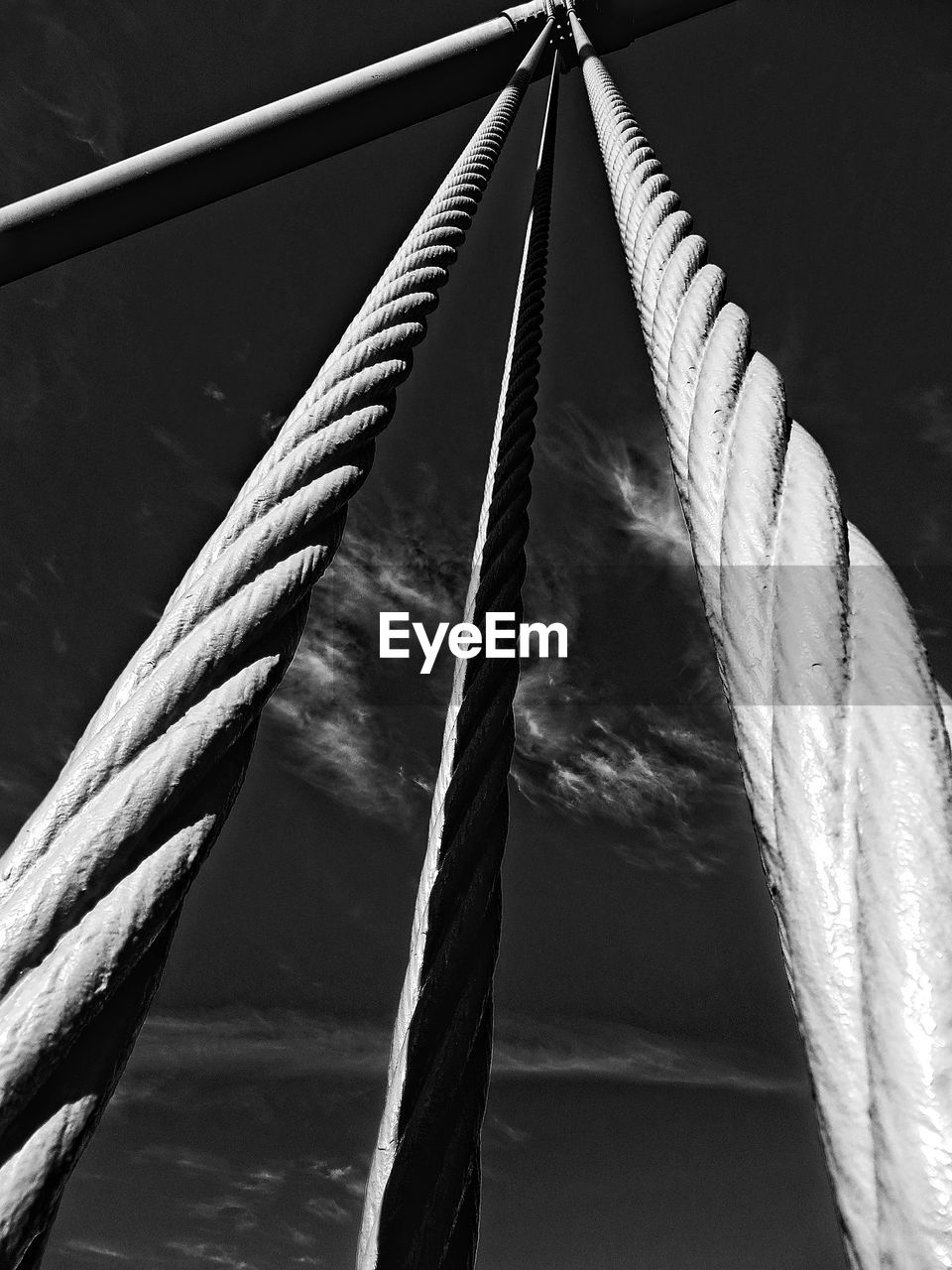 Low angle view of ropes against sky