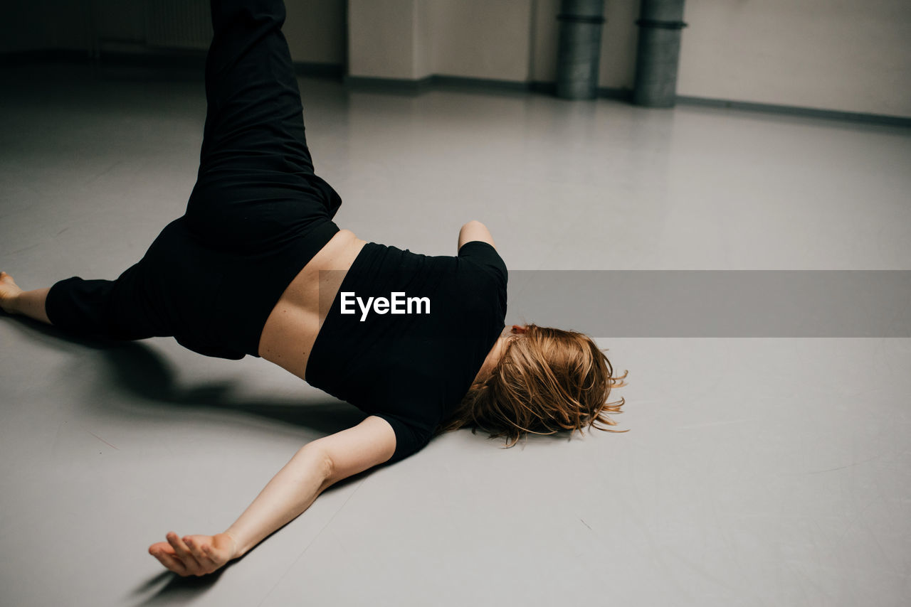 High angle view of woman dancing on floor