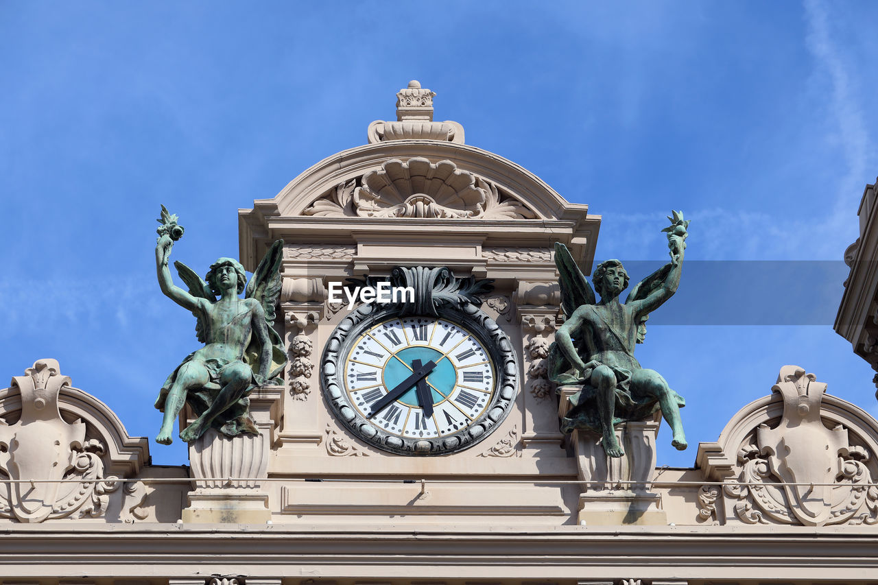 LOW ANGLE VIEW OF CLOCK TOWER AGAINST SKY